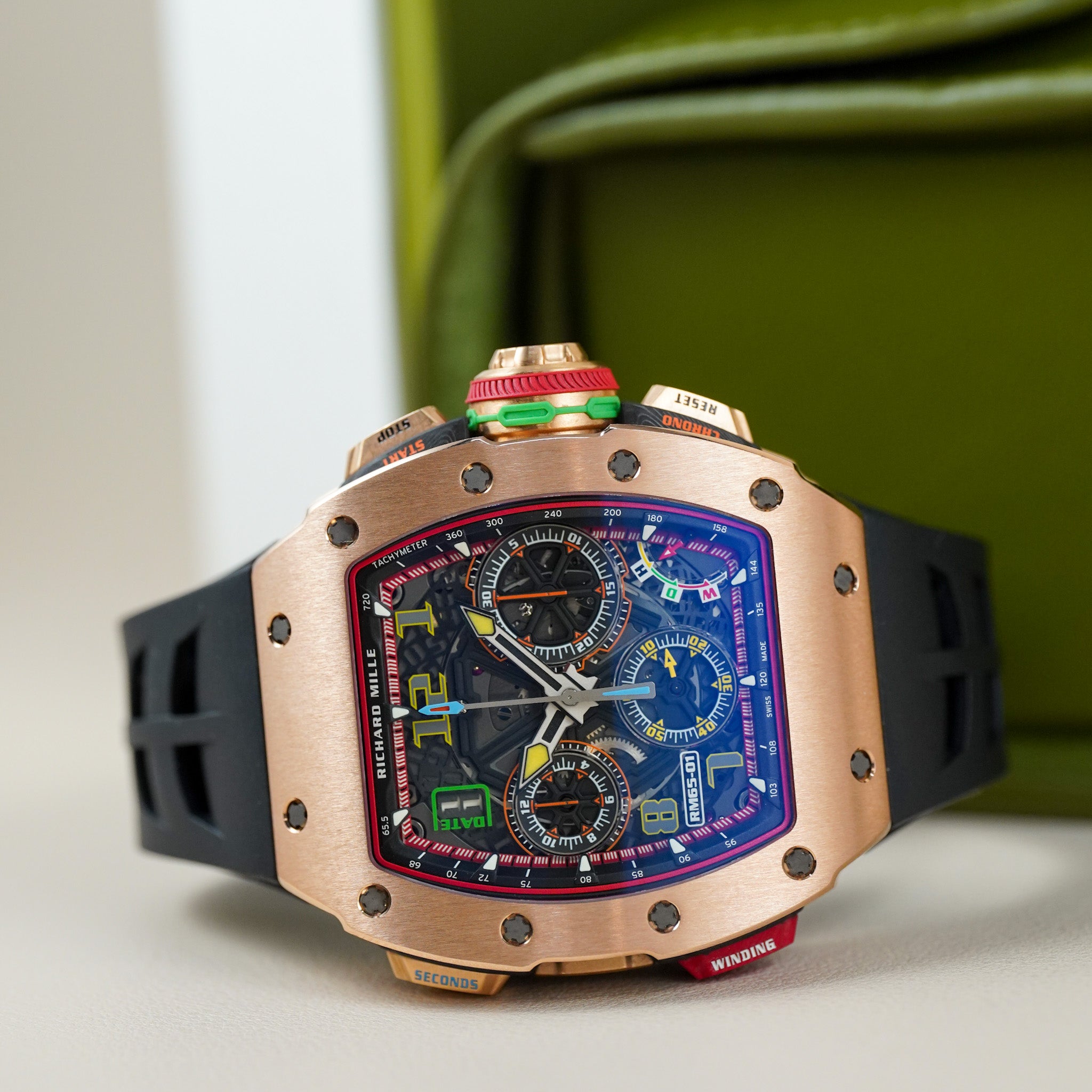 Luxury watch with a detailed face and rose gold case on a light background