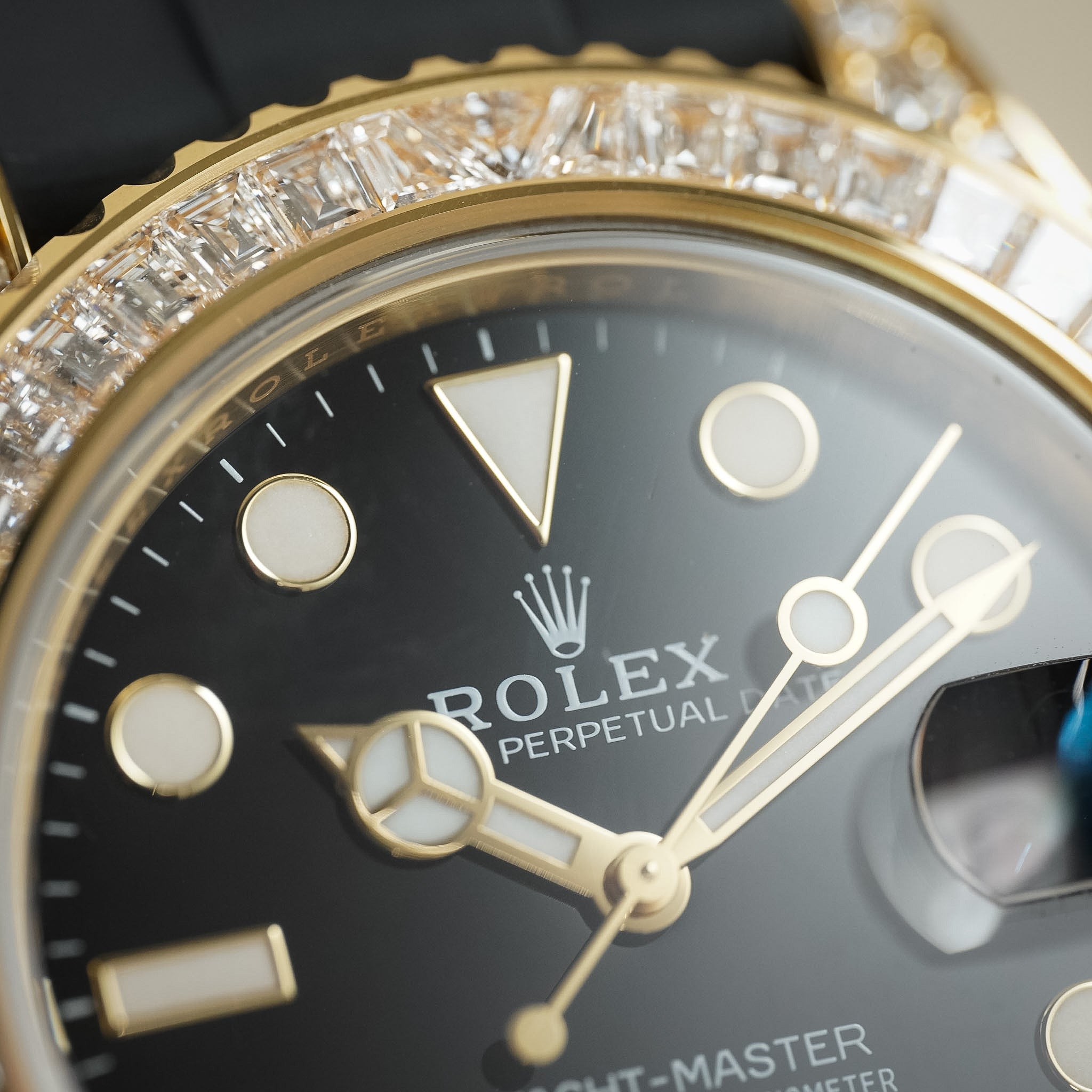 Close-up of a Rolex watch with diamond-studded bezel