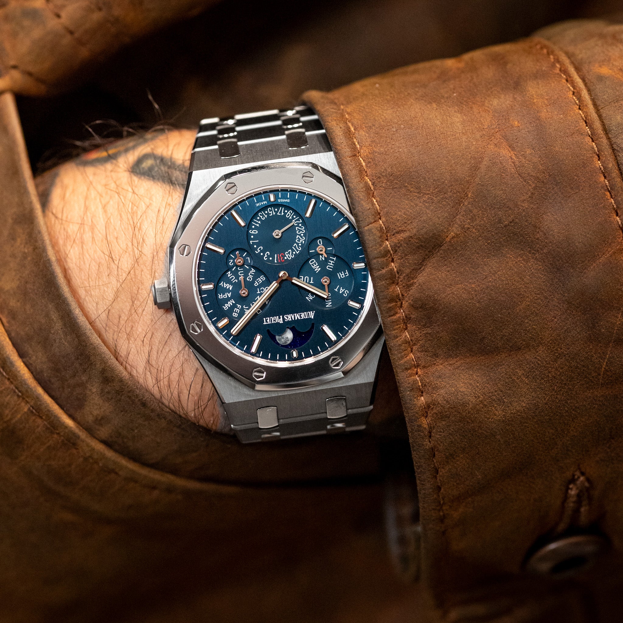 AP Royal Oak Perpetual Calendar RD#2 with a blue dial on-wrist with a brown leather jacket