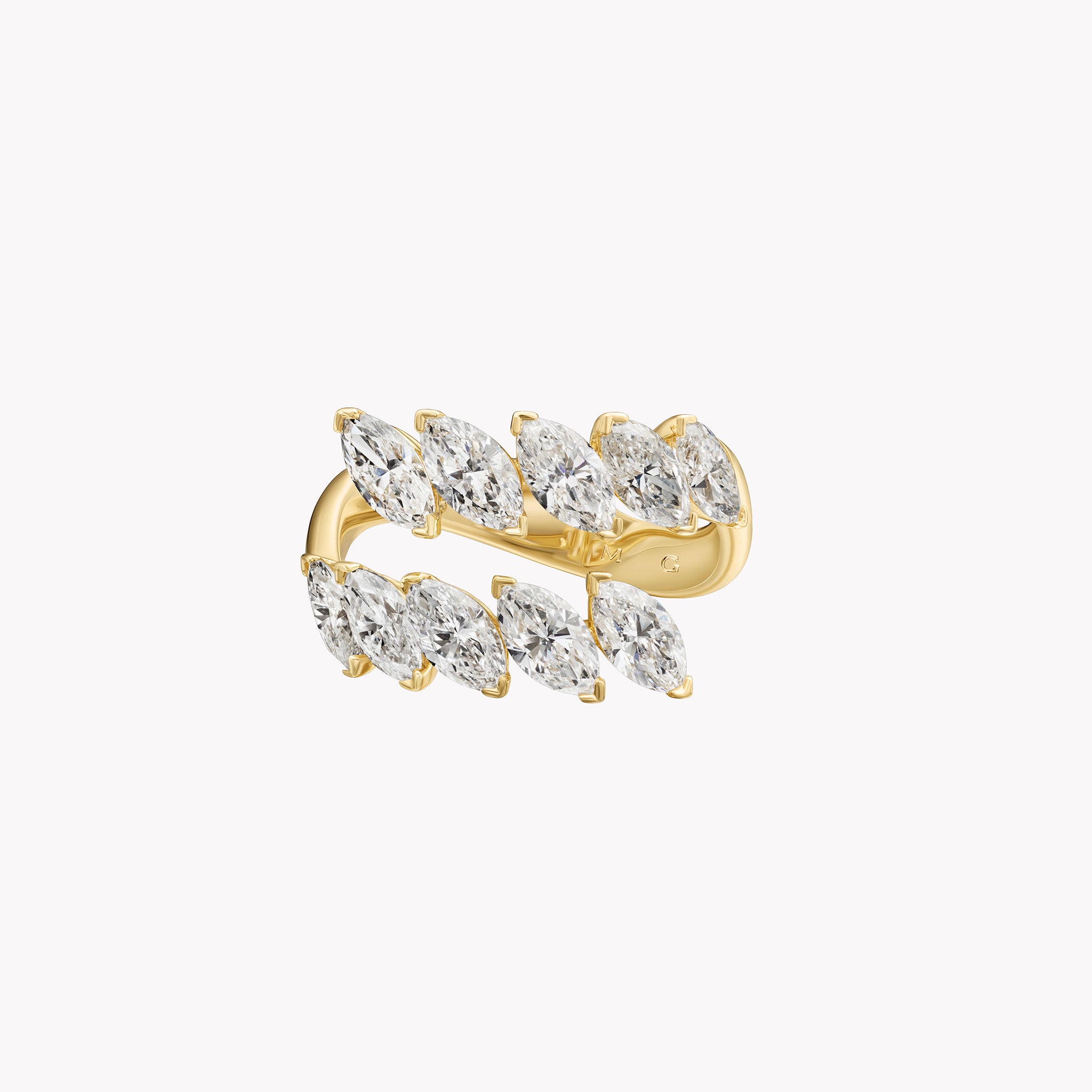 18K yellow gold marquise diamond twist ring with 3.17ct of marquise-cut diamonds.