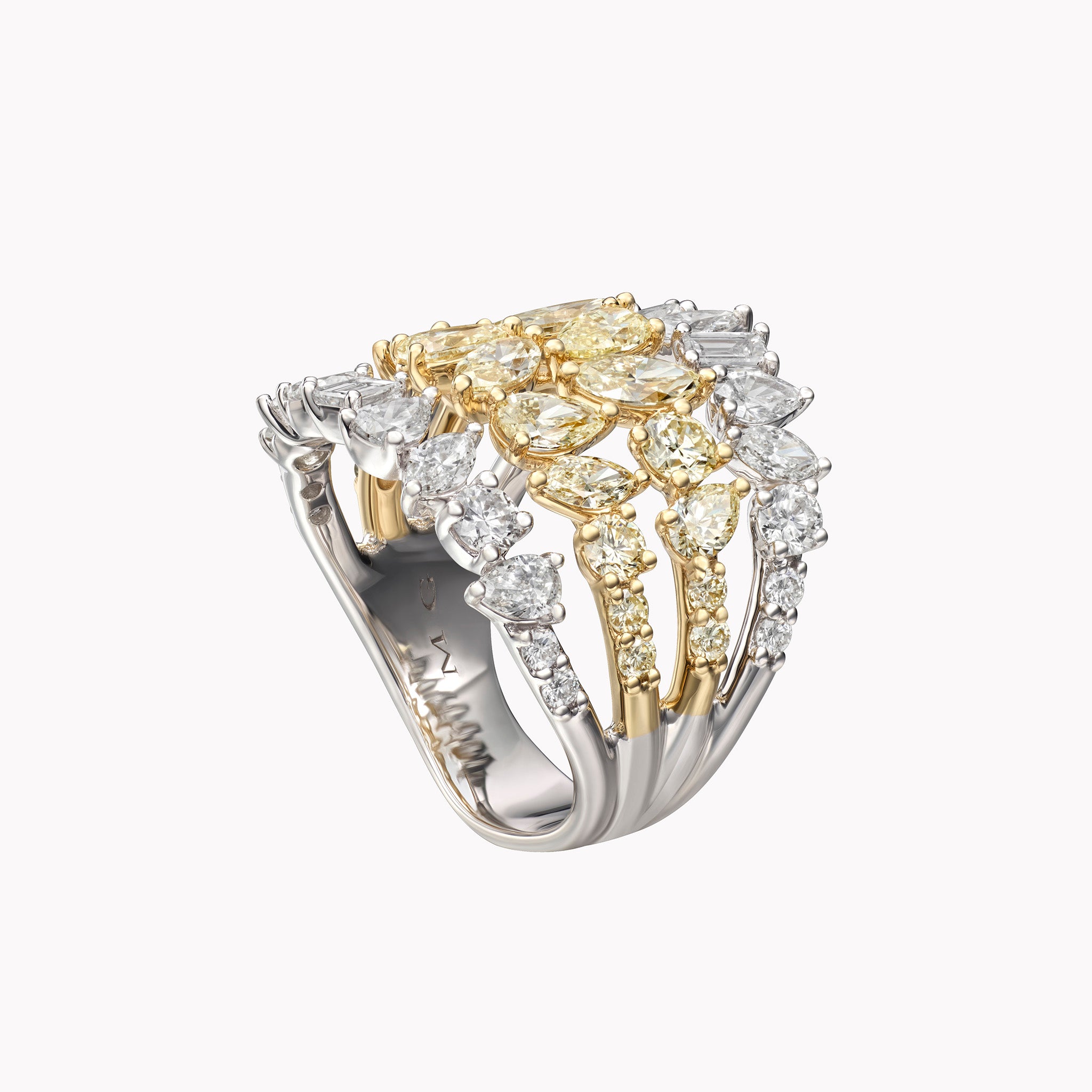 18K white and yellow gold ring with 3.90ct of multi-shape white and yellow diamonds arranged in a sculptural four-row open design.