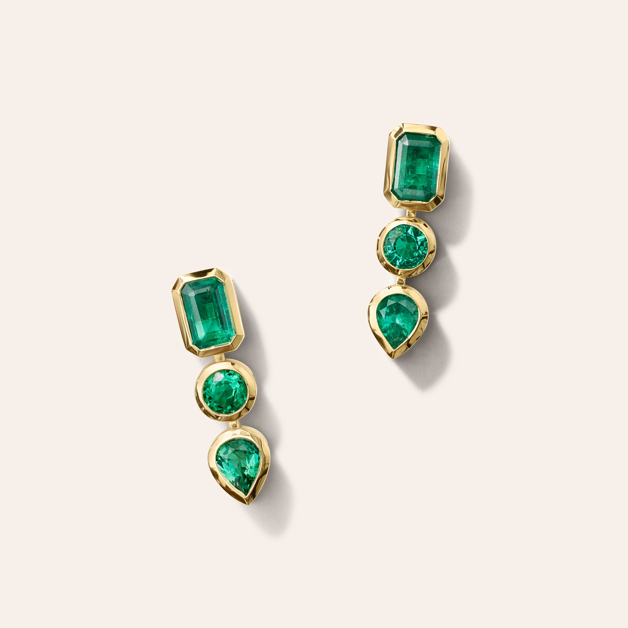 AZLEE Gradient Emerald Earrings in 18K yellow gold, with Zambian emeralds set in a gradient of green.