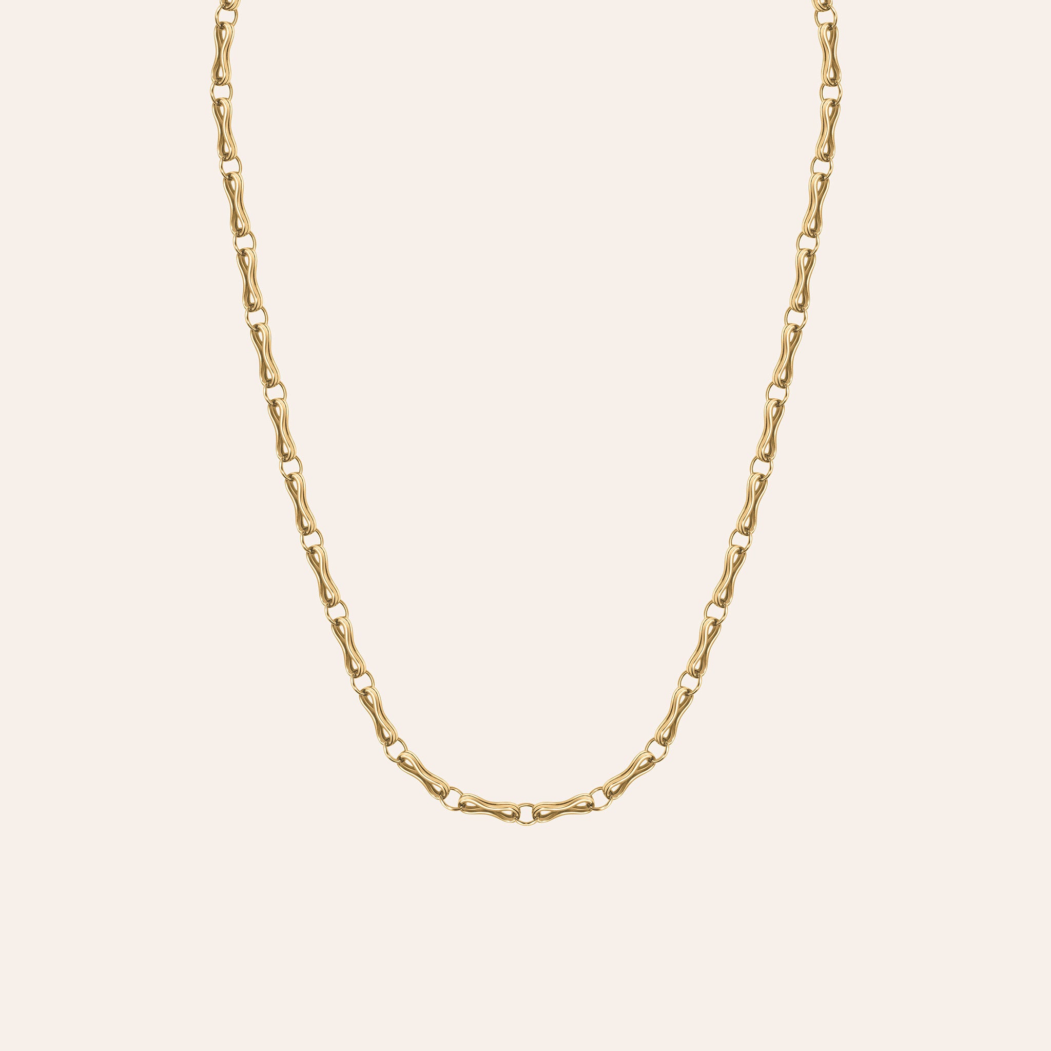 Detail of the Large Double Motif Chain Lariat clasp in 18k yellow gold, worn as a lariat