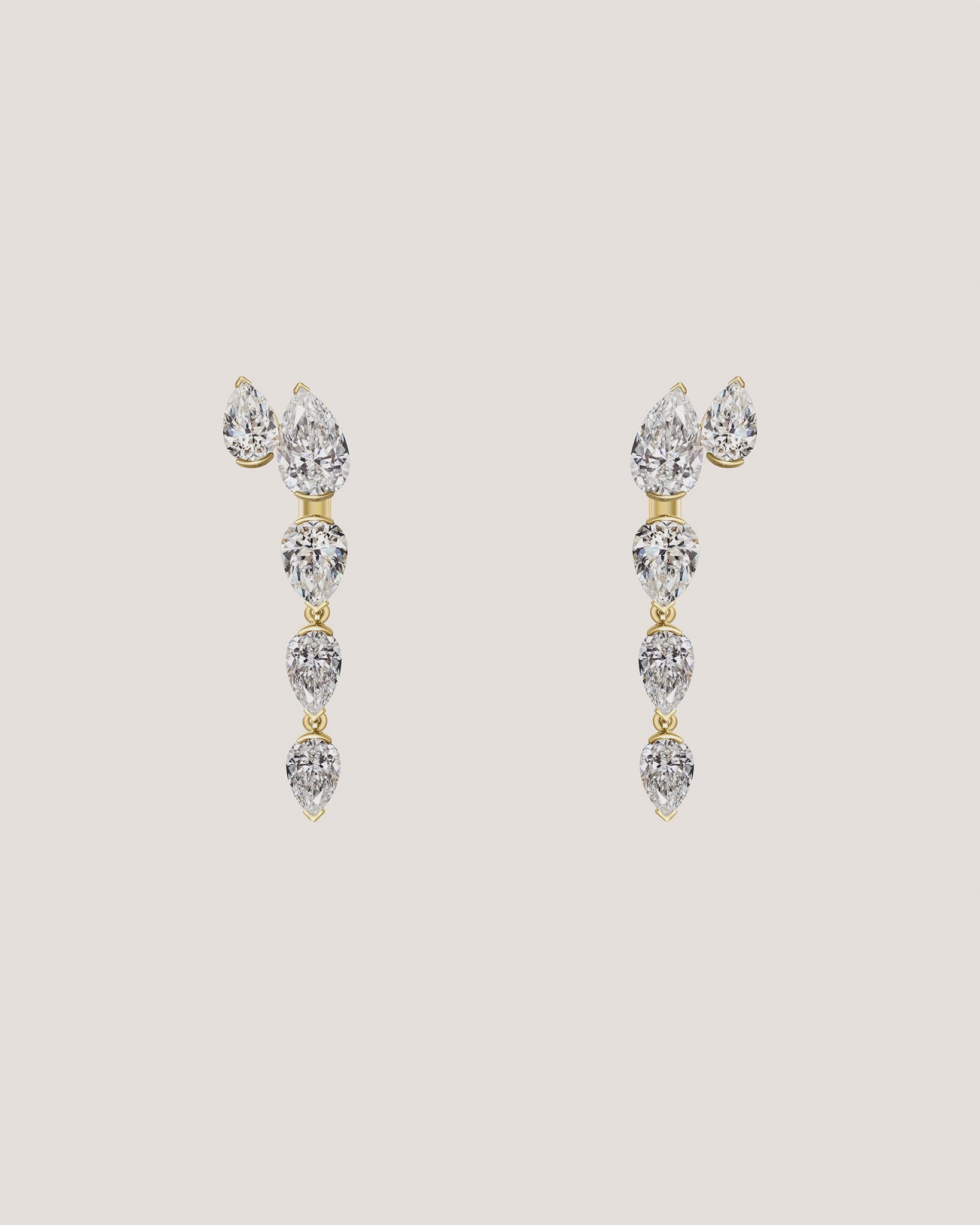 A video of a pair of gold drop earrings with a series of  pear-cut diamonds, displayed on a light beige background.