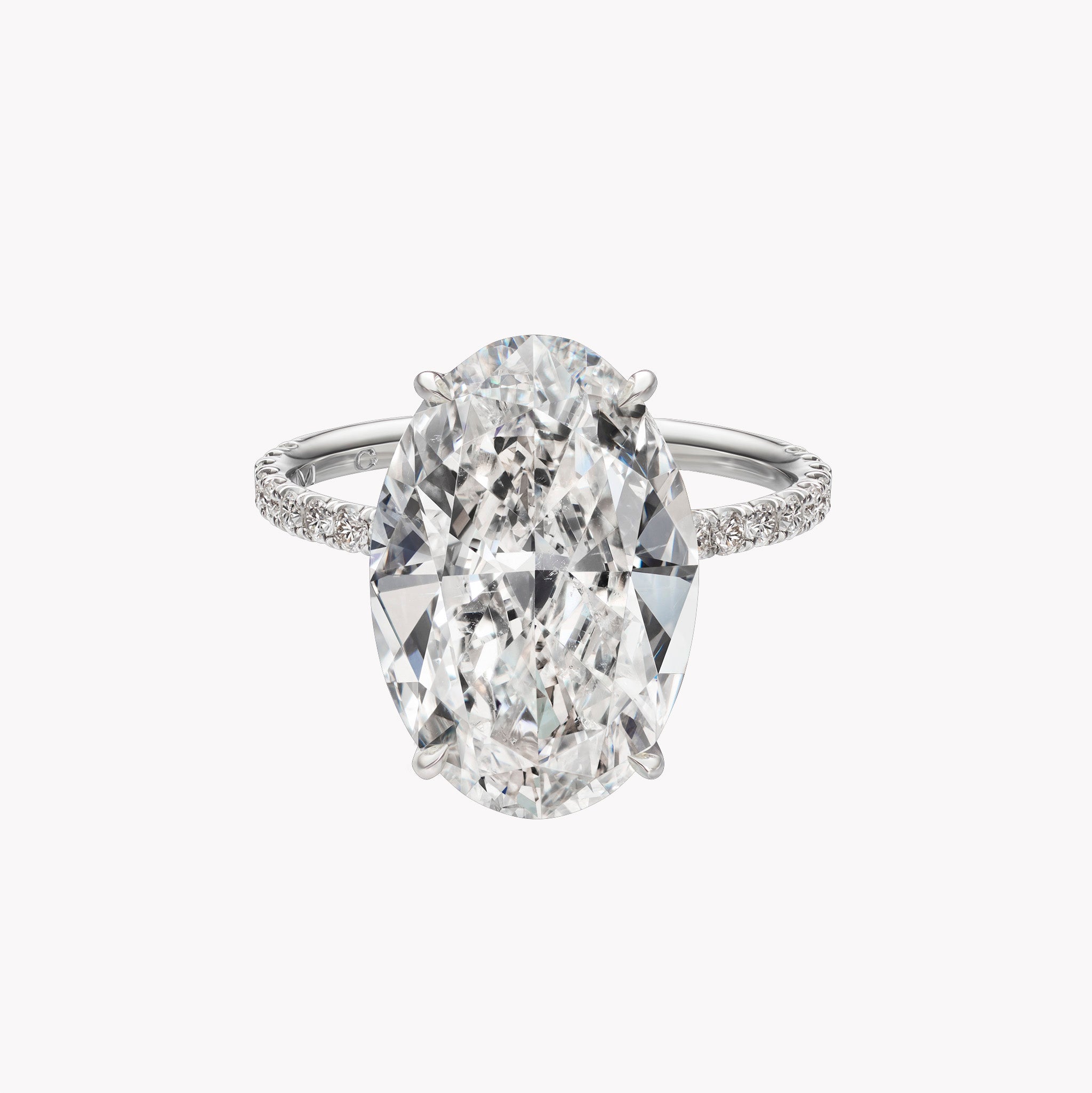 Oval Cut Solitaire Engagement Ring with Diamond Pavé